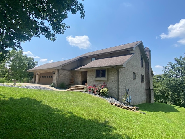 view of front facade with a garage and a front lawn