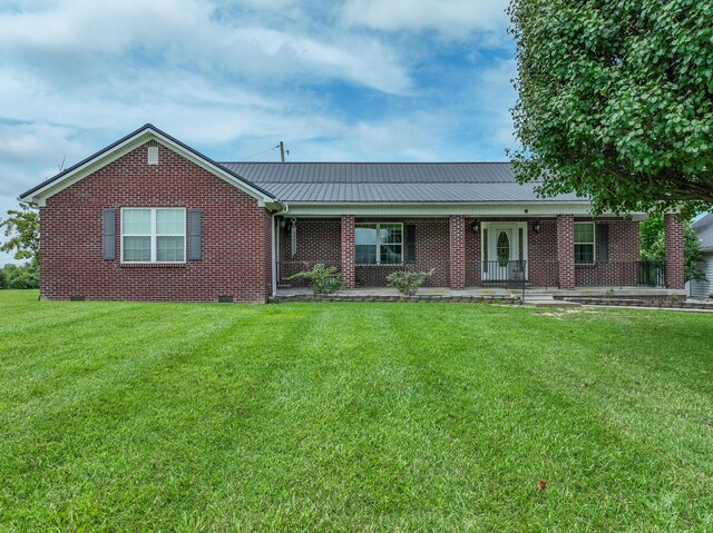 ranch-style home featuring a front yard