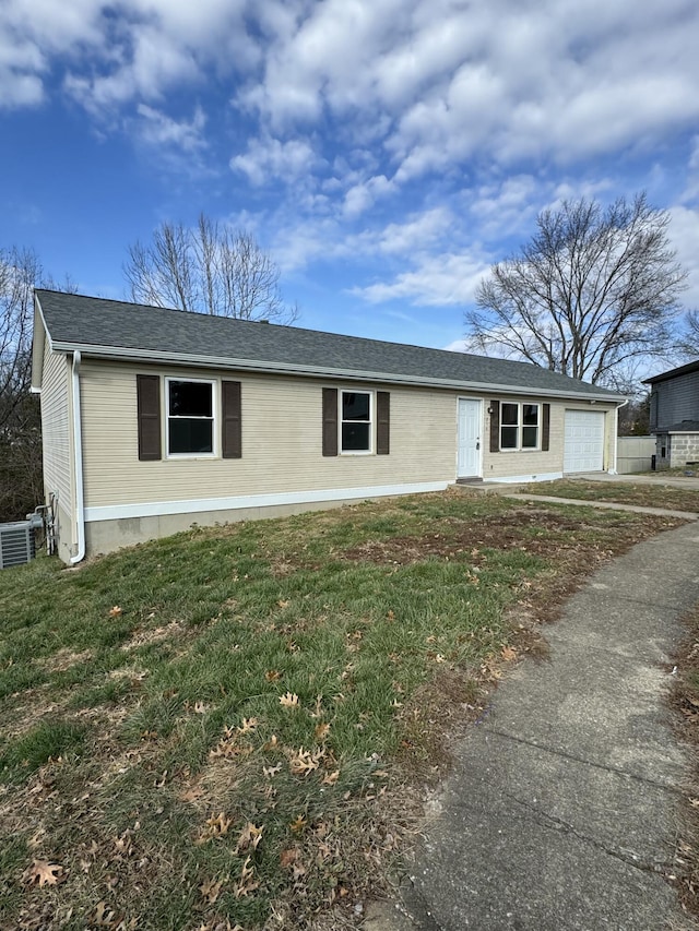 single story home with a front lawn and a garage