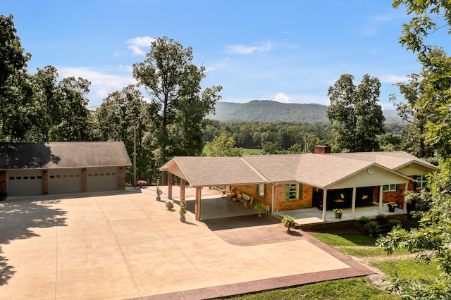 ranch-style house featuring a mountain view and a garage