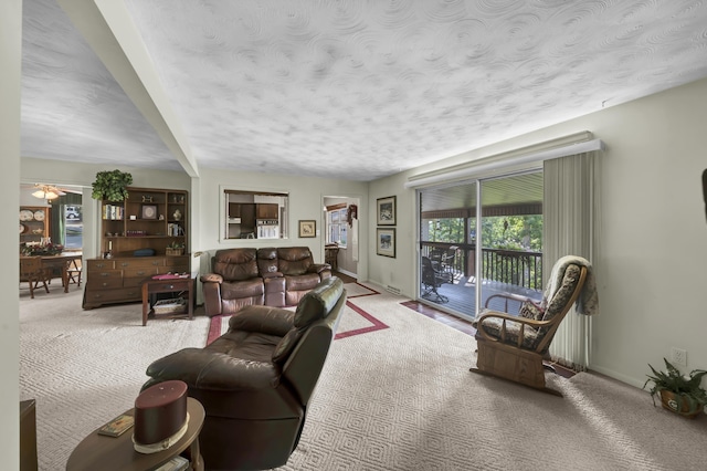 175 N Bend Rd, Stanton, KY 40380 - living room with carpet, a textured ceiling, baseboards, and a ceiling fan