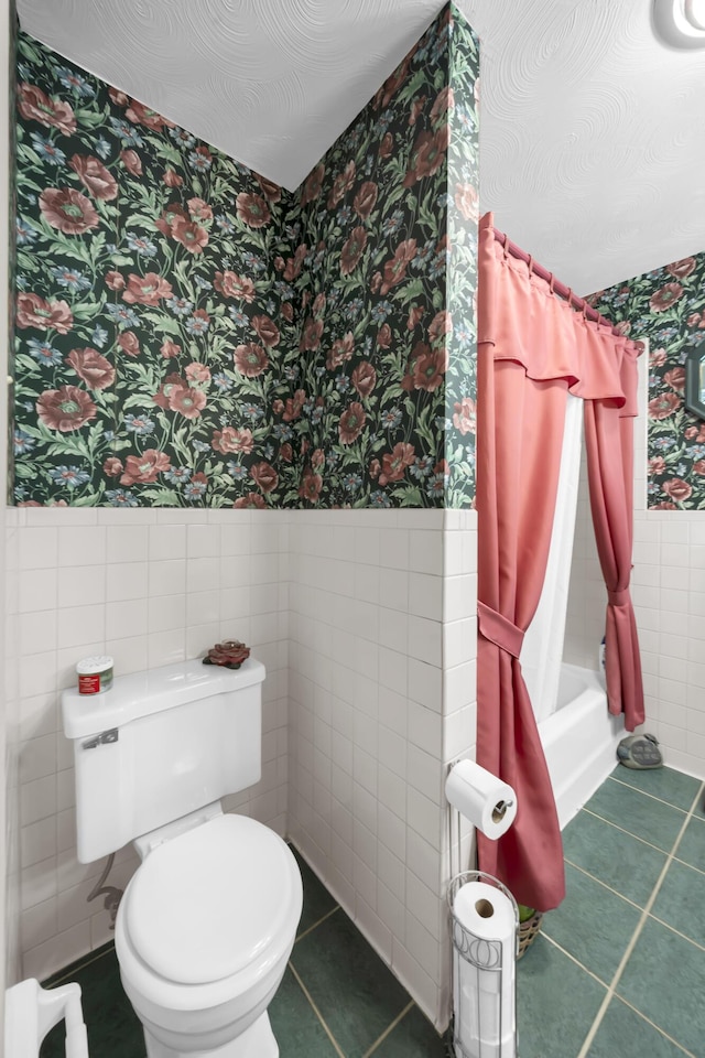 175 N Bend Rd, Stanton, KY 40380 - full bath with wallpapered walls, a wainscoted wall, tile walls, toilet, and tile patterned flooring