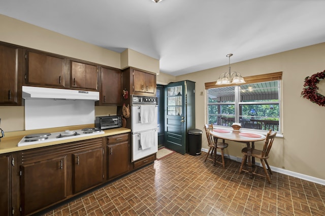 175 N Bend Rd, Stanton, KY 40380 - kitchen with under cabinet range hood, white appliances, baseboards, and brick patterned floors