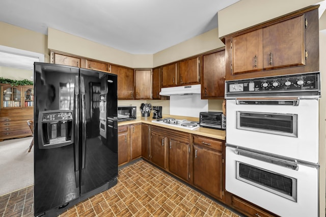 175 N Bend Rd, Stanton, KY 40380 - kitchen with white appliances, light countertops, brick patterned flooring, and under cabinet range hood