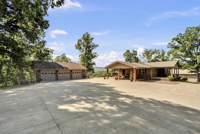 175 N Bend Rd, Stanton, KY 40380 - single story home with a detached garage, covered porch, brick siding, and an outbuilding