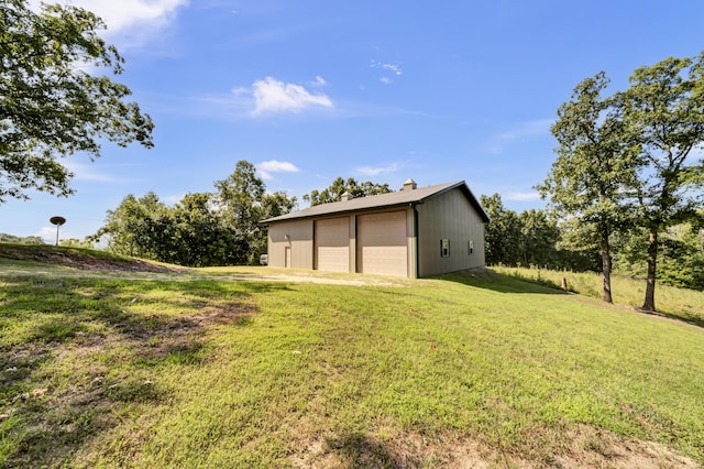 175 N Bend Rd, Stanton, KY 40380 - view of green lawn with a garage and an outbuilding