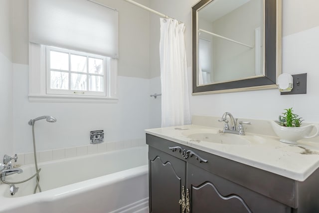 bathroom featuring vanity and shower / tub combo with curtain