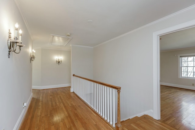 hallway featuring ornamental molding and light wood-type flooring