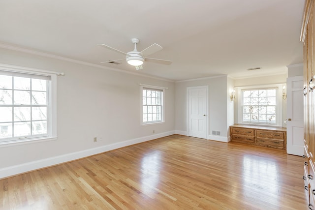 unfurnished bedroom with crown molding, light hardwood / wood-style floors, and multiple windows