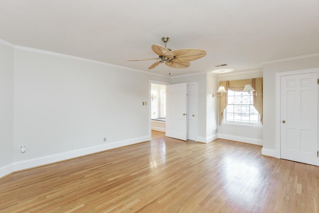 unfurnished room with ornamental molding, ceiling fan, and light wood-type flooring