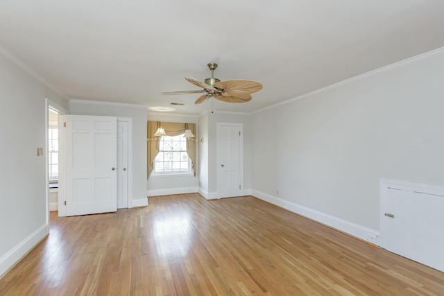 empty room featuring ceiling fan, ornamental molding, and light hardwood / wood-style flooring