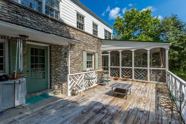 wooden terrace with a sunroom