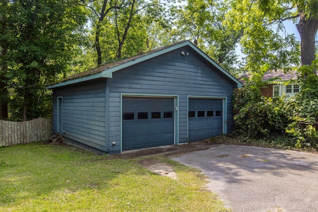 garage featuring a yard