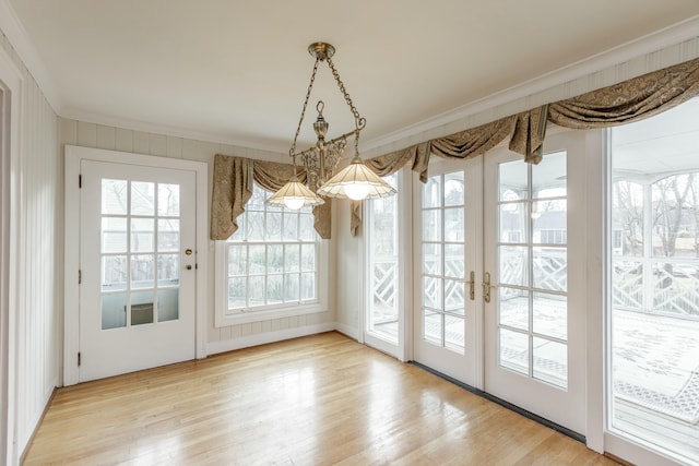 entryway featuring hardwood / wood-style floors and ornamental molding