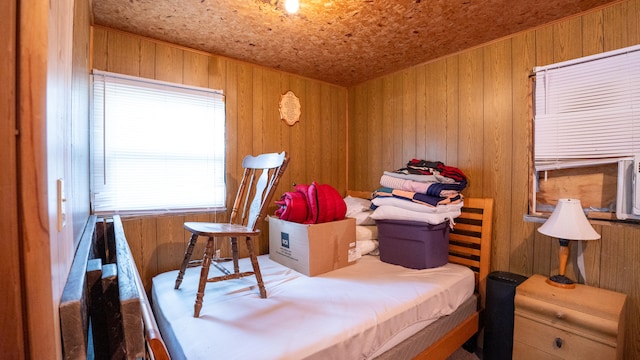 bedroom with wooden walls