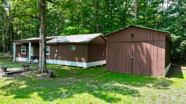 view of outbuilding with a yard