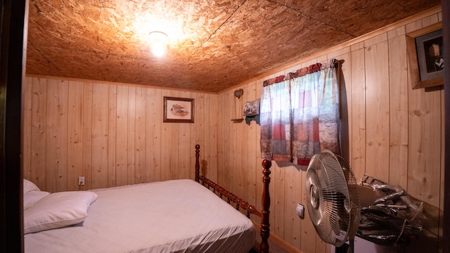 bedroom with wood walls