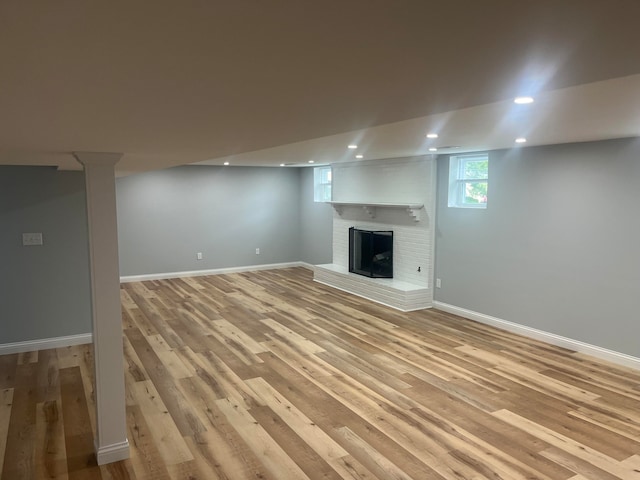 unfurnished living room with light hardwood / wood-style flooring and a fireplace