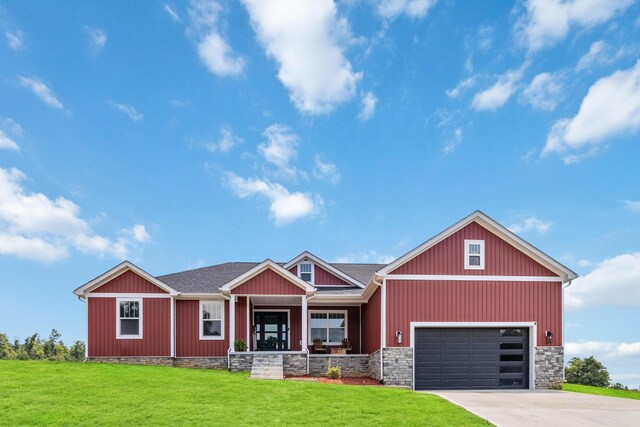 view of front of house featuring a garage and a front yard