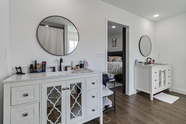 bathroom with vanity and hardwood / wood-style flooring