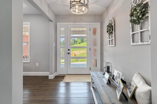 entryway featuring a notable chandelier and hardwood / wood-style floors