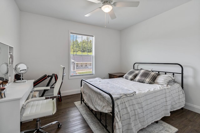 bedroom featuring dark hardwood / wood-style floors and ceiling fan