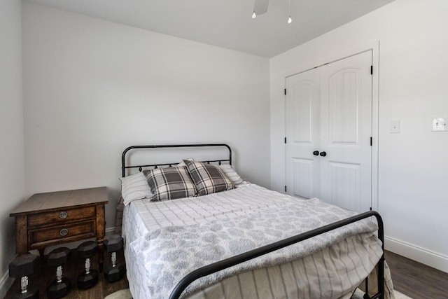 bedroom with a closet, ceiling fan, and hardwood / wood-style floors