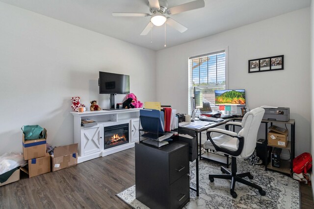 home office with wood-type flooring and ceiling fan