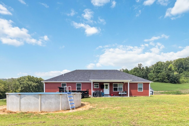 exterior space with a front yard and covered porch