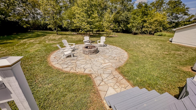 view of yard with a patio and a fire pit