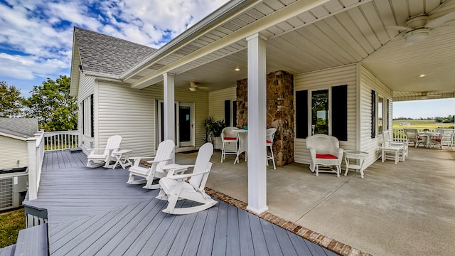 wooden deck featuring ceiling fan