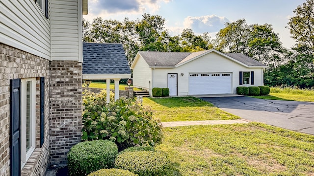 view of front of property with a front lawn and a garage