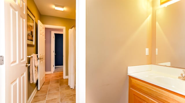 bathroom featuring tile patterned floors and vanity