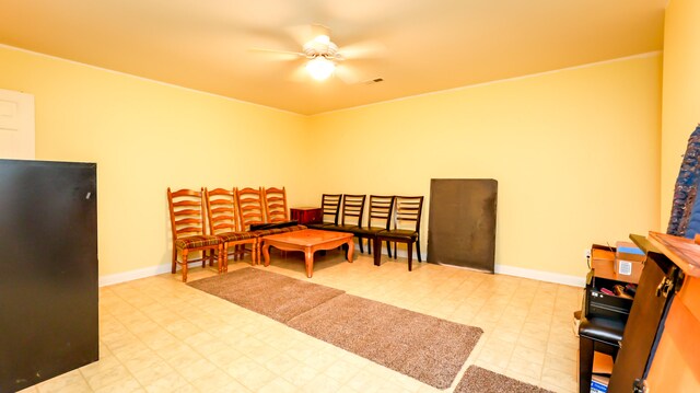 interior space with light tile patterned floors and ceiling fan