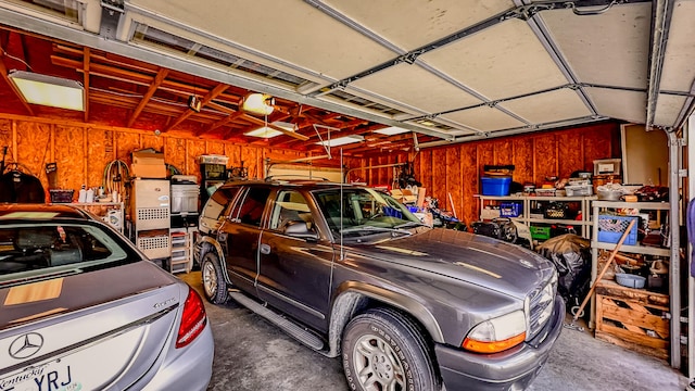 garage featuring wooden walls