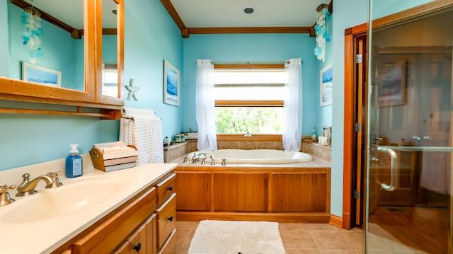 bathroom with vanity, ornamental molding, a tub to relax in, and tile patterned flooring