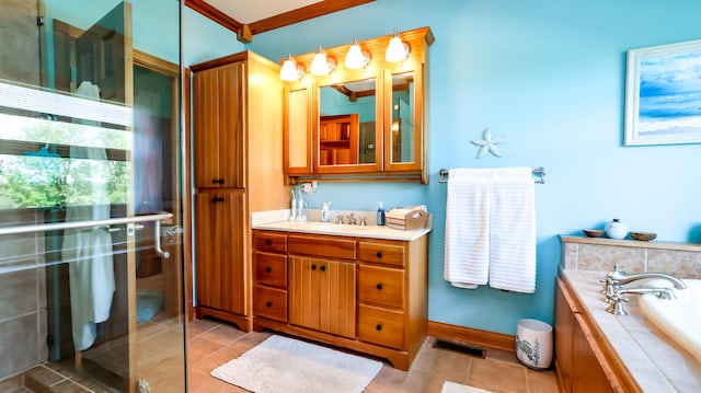 bathroom with tile patterned floors, vanity, ornamental molding, and a washtub