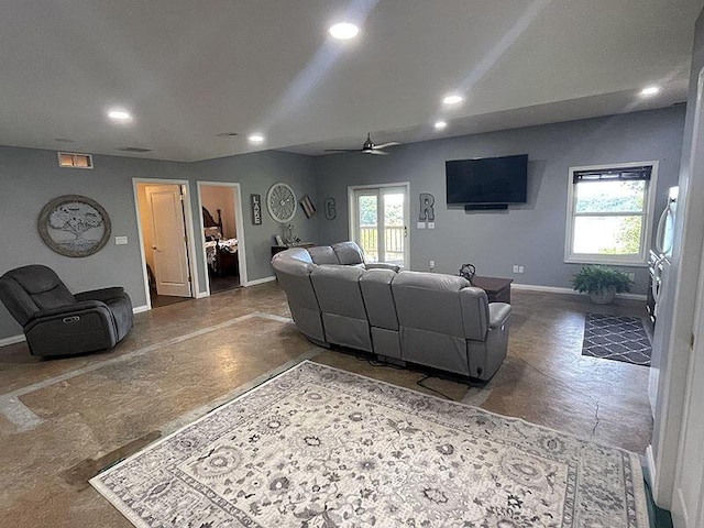 living room featuring visible vents, baseboards, ceiling fan, finished concrete floors, and recessed lighting