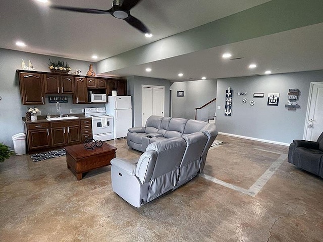 living room with recessed lighting, stairway, a ceiling fan, concrete flooring, and baseboards