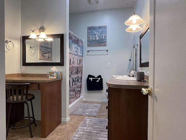 full bath featuring curtained shower, tile patterned flooring, baseboards, and vanity