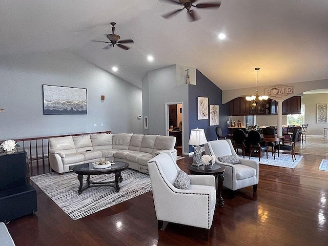 living room featuring arched walkways, high vaulted ceiling, ceiling fan with notable chandelier, wood finished floors, and baseboards