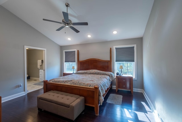 bedroom featuring ceiling fan, connected bathroom, dark hardwood / wood-style flooring, and vaulted ceiling