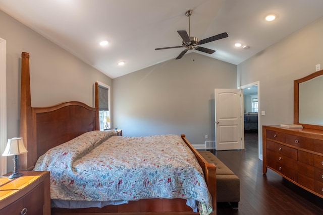 bedroom with dark hardwood / wood-style flooring, vaulted ceiling, and ceiling fan