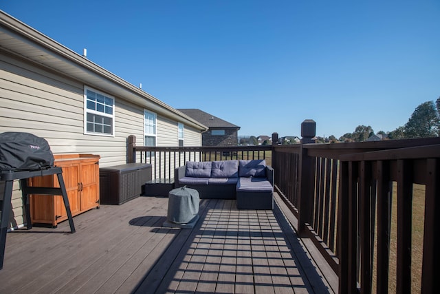 wooden deck with an outdoor living space