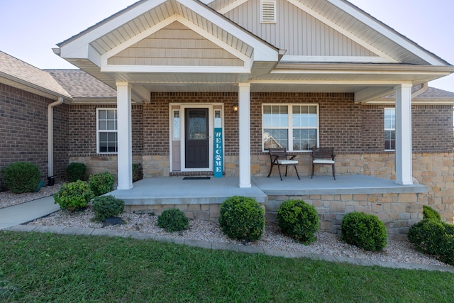 entrance to property featuring a porch