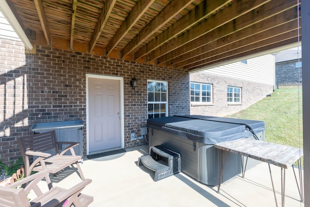 view of patio / terrace featuring a hot tub