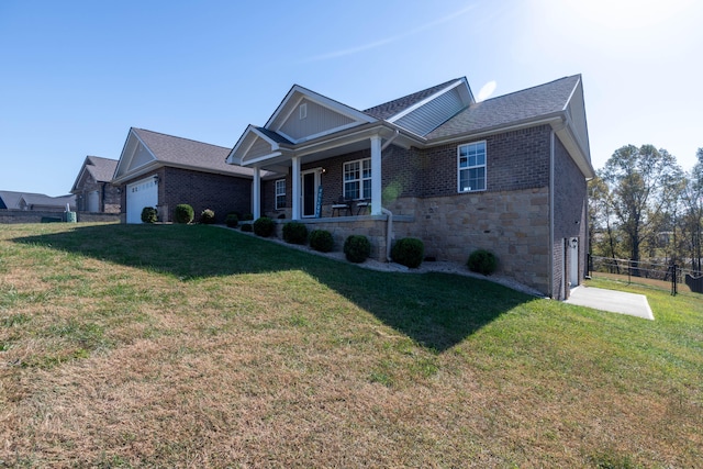 view of front of home with a garage, a porch, and a front lawn