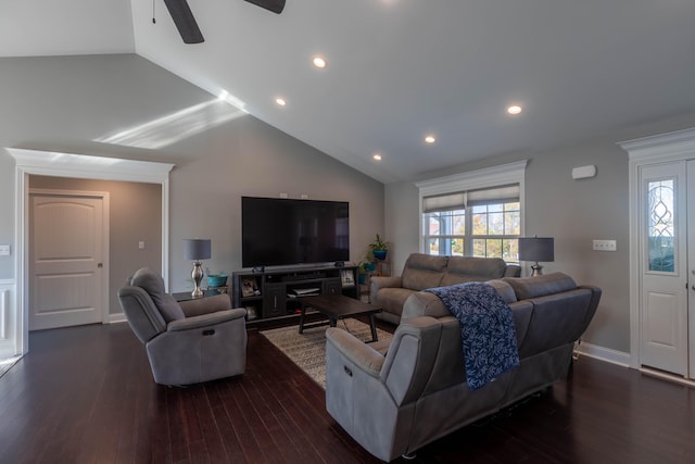 living room with high vaulted ceiling and dark hardwood / wood-style flooring