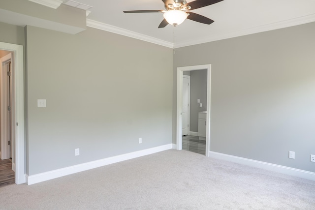 unfurnished room with crown molding, light colored carpet, and ceiling fan