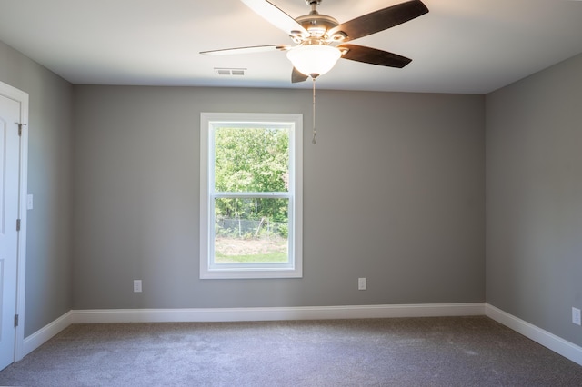 unfurnished room featuring ceiling fan and carpet flooring